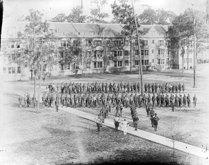UF Marching Band in formation in front of Buckman Hall.