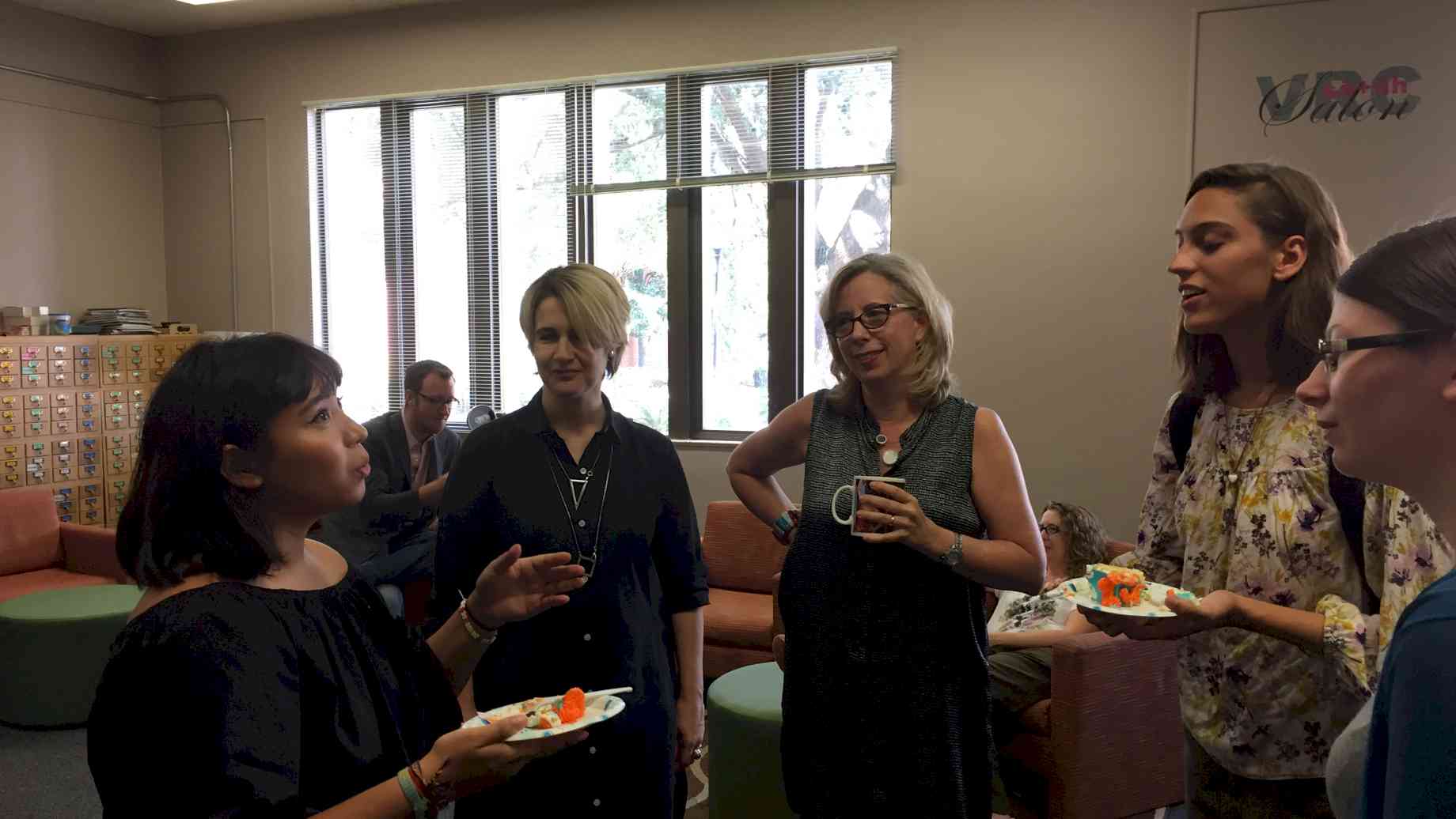 Profs Cabanas and Hyde with students at annual Cake & Conviviality reception for new majors
